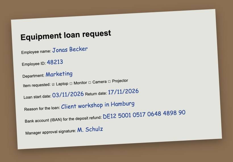 A phone photo of a filled-in paper form for an equipment loan, on a desk